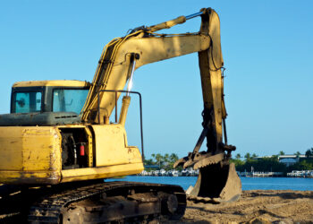 Construction equipment sits at the water's edge in Bonita Springs. (iStockphoto image)