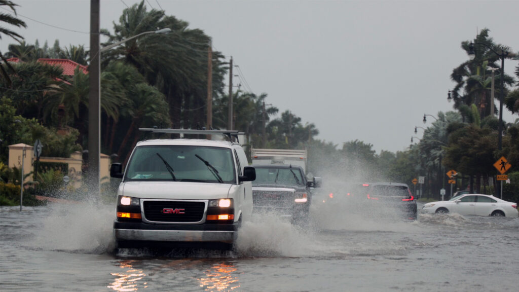 Cars pass through a flooded road during Hurricane Nicole in Palm Beach in 2022. (iStockphoto image)