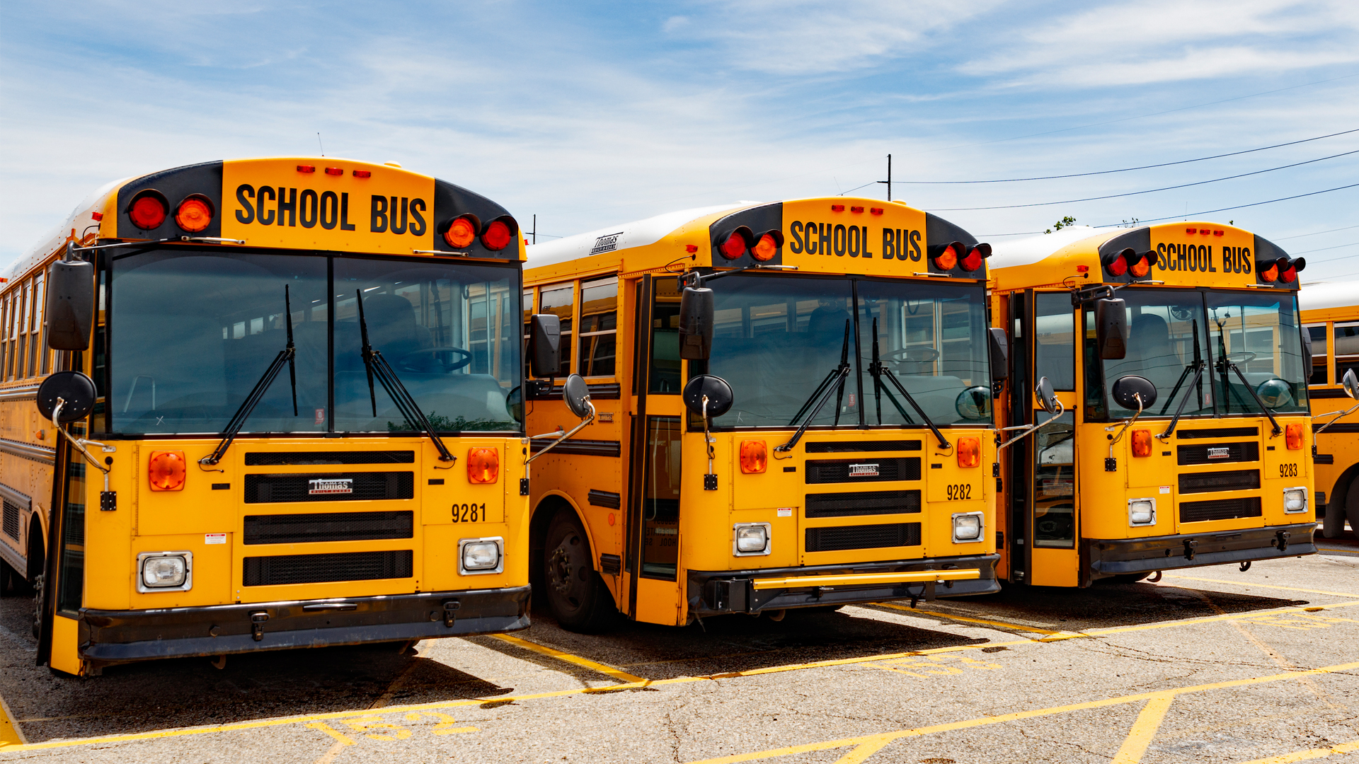 School buses in a parking lot. (iStockphoto image)
