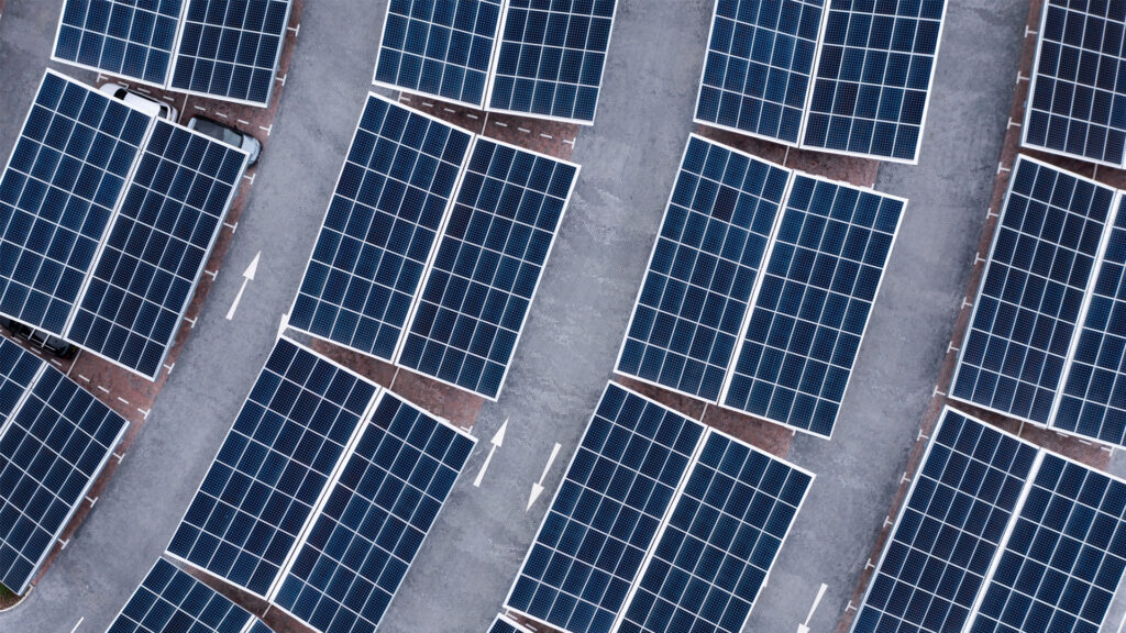 An aerial view of solar panels on a parking lot rooftop. (iStockphoto image)