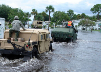 Members of the Florida National Guard enter a mobile home park in Melbourne to evacuate residents in the wake of Tropical Storm Fay in 2008. (DVIDSHUB, CC BY 2.0, via Wikimedia Commons)