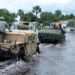 Members of the Florida National Guard enter a mobile home park in Melbourne to evacuate residents in the wake of Tropical Storm Fay in 2008. (DVIDSHUB, CC BY 2.0, via Wikimedia Commons)