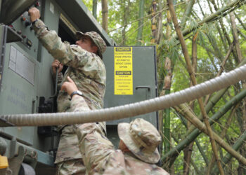 Soldiers from the Puerto Rico National Guard operate a system that distributes water to the public in the wake of Hurricane Fiona in 2022. (The National Guard, CC BY 2.0, via Wikimedia Commons)
