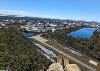 A crewmember's view of Sanibel Island from a helicopter operated by the New York Army National Guard on Oct. 2, 2022, during a mission assisting the Florida National Guard in responding to the destruction caused by Hurricane Ian. (U.S. Army National Guard photo by Sgt. Samuel Sacco)