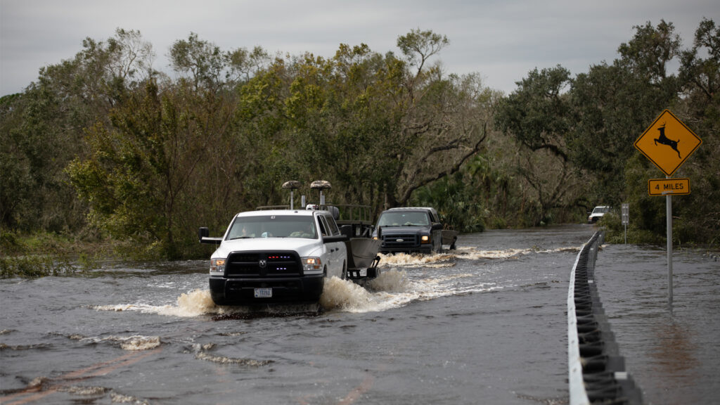 Florida National Guard members maneuver flooded roads in Sarasota on Sept. 29, 2022, while supporting Hurricane Ian relief efforts. (The National Guard, CC BY 2.0, via Wikimedia Commons)