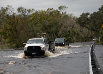 Florida National Guard members maneuver flooded roads in Sarasota on Sept. 29, 2022, while supporting Hurricane Ian relief efforts. (The National Guard, CC BY 2.0, via Wikimedia Commons)