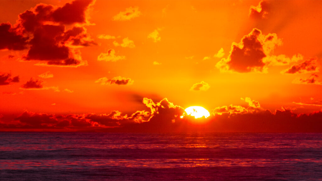 The sun rises over the Atlantic Ocean. (Charles Patrick Ewing, CC BY 2.0, via Wikimedia Commons)