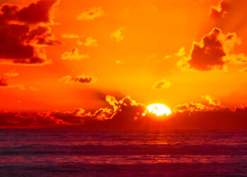 The sun rises over the Atlantic Ocean. (Charles Patrick Ewing, CC BY 2.0, via Wikimedia Commons)