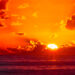 The sun rises over the Atlantic Ocean. (Charles Patrick Ewing, CC BY 2.0, via Wikimedia Commons)