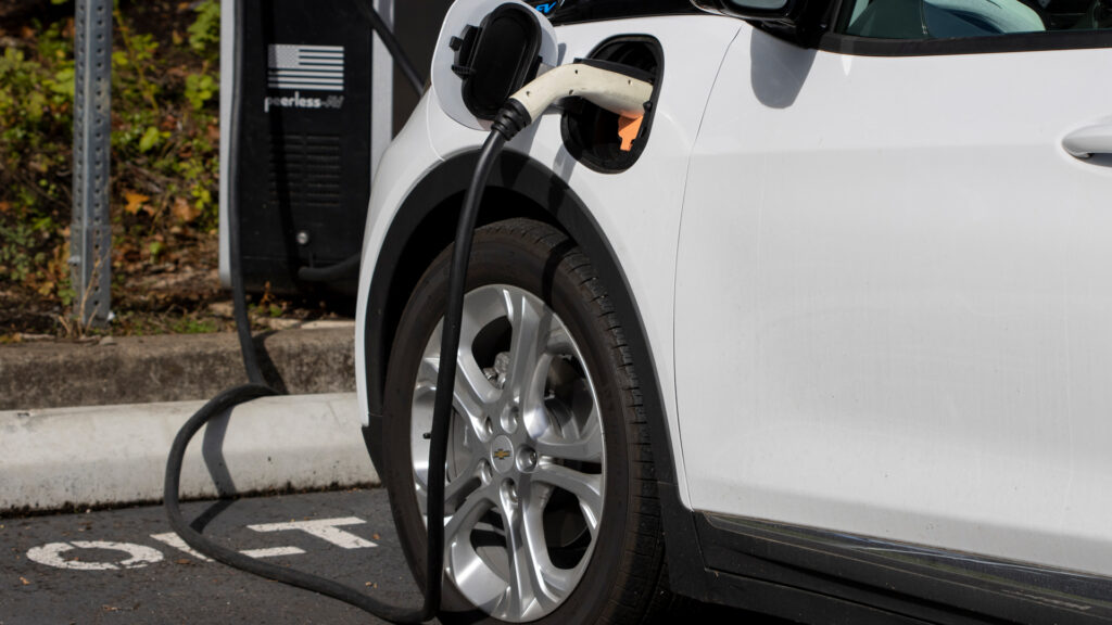 A Chevy Bolt EV electric car is seen charging at a public charging station. (iStock)