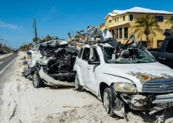 Vehicles damaged by Hurricane Ian (iStock image)