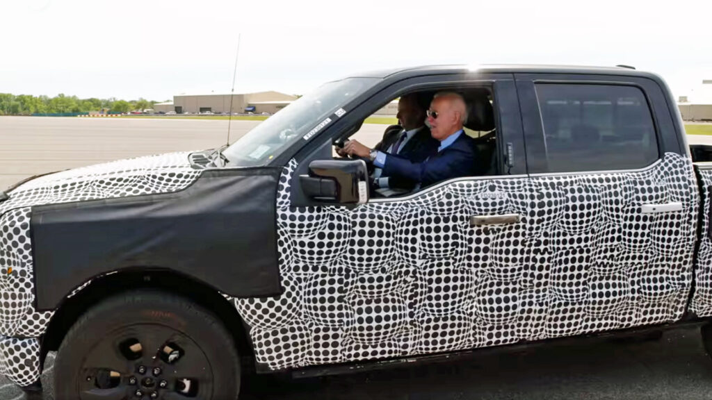 President Joe Biden test drives a Ford F-150 Lightning all-electric pickup at Ford’s Rouge Electric Vehicle Center in Dearborn, Michigan, in 2021 (The White House, Public domain, via Wikimedia Commons)
