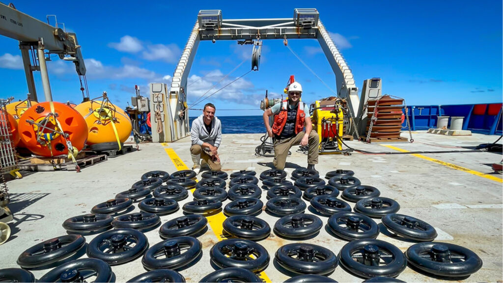 Rosenstiel School senior research associate Cedric Guigand, left, and assistant scientist Guillaume Novelli inventory some of the 200 surface drifters that were deployed during the 26-day cruise in the Cape Cauldron. (Image courtesy of Cedric Guigand)