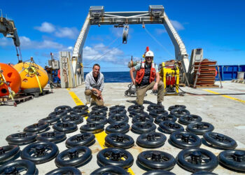 Rosenstiel School senior research associate Cedric Guigand, left, and assistant scientist Guillaume Novelli inventory some of the 200 surface drifters that were deployed during the 26-day cruise in the Cape Cauldron. (Image courtesy of Cedric Guigand)