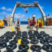 Rosenstiel School senior research associate Cedric Guigand, left, and assistant scientist Guillaume Novelli inventory some of the 200 surface drifters that were deployed during the 26-day cruise in the Cape Cauldron. (Image courtesy of Cedric Guigand)