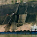 A coal shipment underway in China (Rob Loftis retouched by Dave606 at en.wikipedia, CC BY 3.0, via Wikimedia Commons)