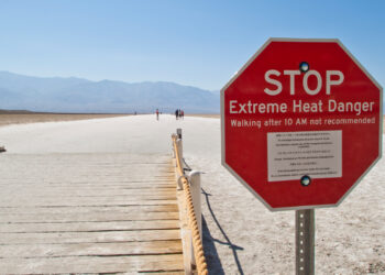 A sign warms of extreme heat warning in Death Valley, California. (Graeme Maclean, CC BY 2.0, via Wikimedia Commons)