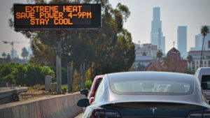 A sign warns of extreme heat and the need to save power in Los Angeles. (Chris Yarzab, CC BY 2.0, via Wikimedia Commons)