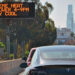 A sign warns of extreme heat and the need to save power in Los Angeles. (Chris Yarzab, CC BY 2.0, via Wikimedia Commons)