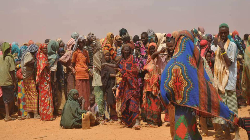 People displaced by drought in Somalia wait to be registered by aid agencies running a refugee camp in neighboring Ethiopia. (Cate Turton/Department for International Development, CC BY 2.0, via Wikimedia Commons)