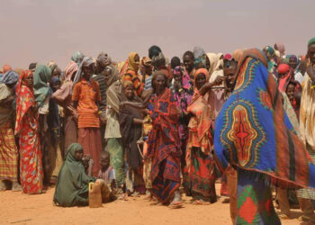 People displaced by drought in Somalia wait to be registered by aid agencies running a refugee camp in neighboring Ethiopia. (Cate Turton/Department for International Development, CC BY 2.0, via Wikimedia Commons)