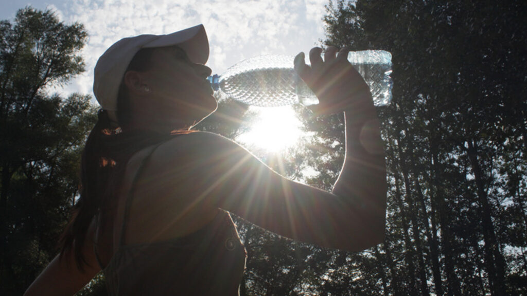 A woman drinking water (Emilian Robert Vicol, CC BY 2.0)