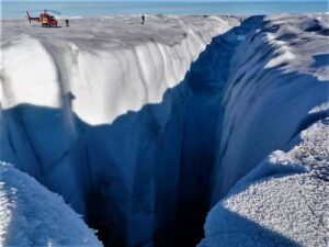 High rates of meltwater discharge combined with a thick and gently sloping ice sheet in Western Greenland gives rise to monster holes like this moulin. (Alun Hubbard)