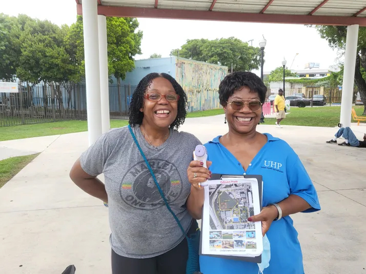 One of Catalyst Miami's Overtown Community Champions working with Urban Health Partnerships on a heat study. (Credit: Catalyst Miami)