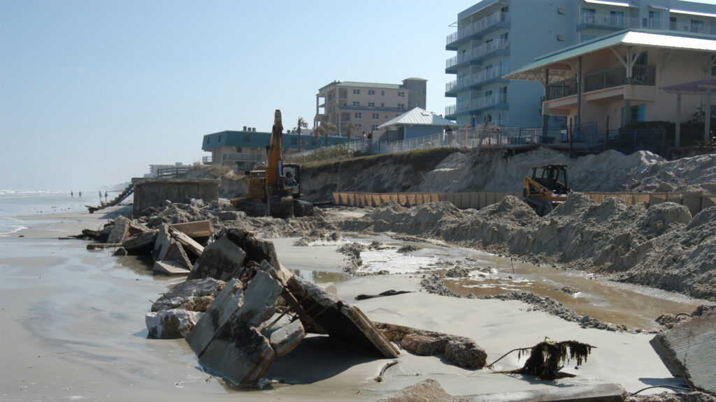 A seawall and erosion on New Smyrna Beach caused by the storm surge and wave action of Hurricane Jeanne. (FEMA Photo/Mark Wolfe, Public domain, via Wikimedia Commons)