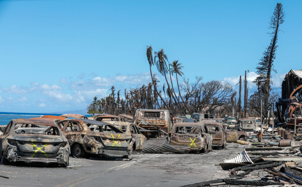 Damaged buildings and vehicles destroyed in the Lahaina wildfires in Maui, Hawaii, on Aug. 18, 2023. (Spc. Sean Walker, Public domain, via Wikimedia Commons)