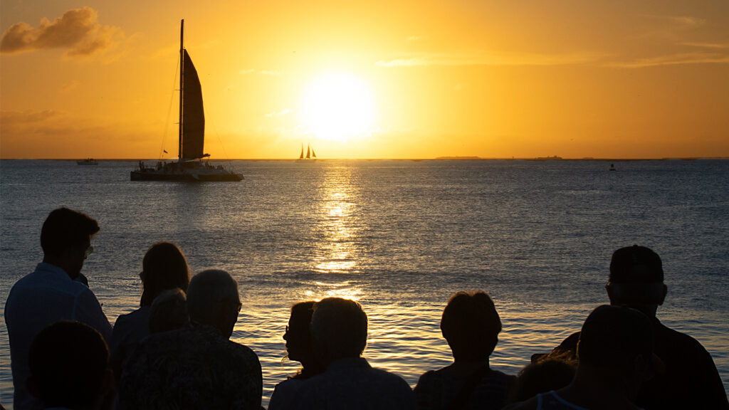 A group watches the sunset from Mallory Square in Key West (watts_photos, CC BY 2.0, via flickr)