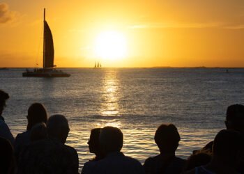 A group watches the sunset from Mallory Square in Key West (watts_photos, CC BY 2.0, via flickr)