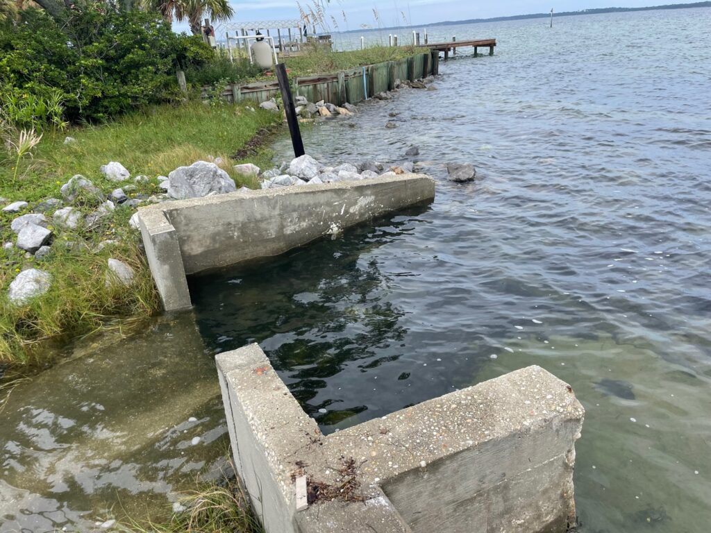 A storm drain on Pensacola Beach allows the free flow of water directly into a residential street. (Photo credit: Carrie Stevenson, UF/IFAS Extension)