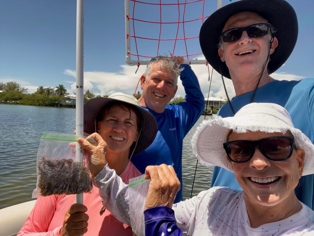 Volunteers with ties to the Lemon Bay Conservancy show an algae sample they collected as part of Eyes on Seagrass protocol. (Courtesy Lemon Bay Conservancy)