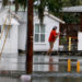 A person canoes through flooded streets in Tarpon Springs after Hurricane Idalia passed offshore on Aug. 30. (Joe Raedle/Getty Images via Grist)