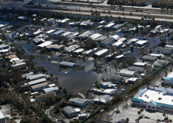 Flooding and damage in Lee County from Hurricane Ian (U.S. Coast Guard photo by Petty Officer Third Class Riley Perkofski, CC BY-NC-ND 2.0, edited for size, via flickr)