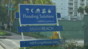 A sign touting climate adaptation projects in Miami Beach (B137, CC BY-SA 4.0, via Wikimedia Commons)