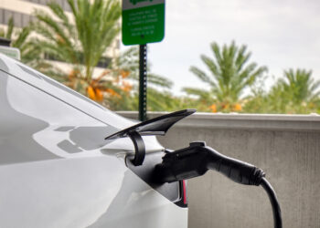 An electric vehicle charging in a parking garage in St. Petersburg. (iStock image)