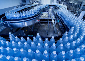 A conveyer belt of bottled water (iStock image)