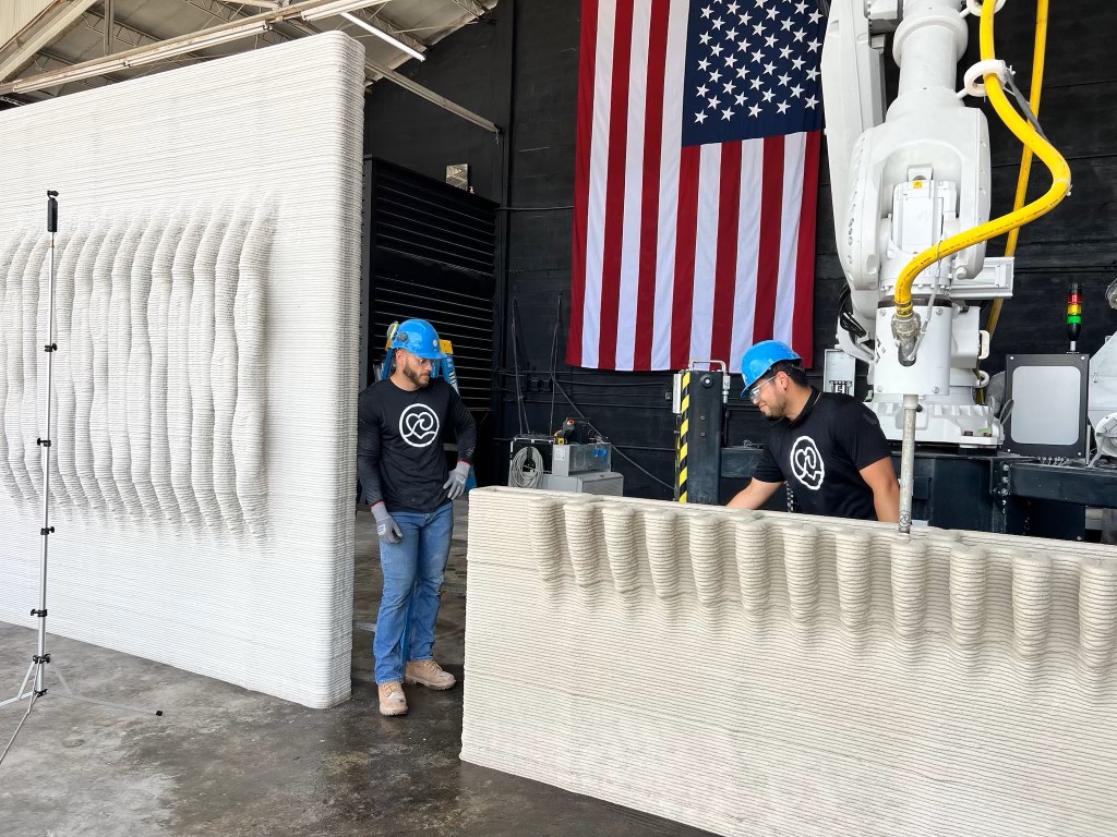 Workers at Kind Designs with 3D-printed panels for a private seawall project in Miami. (Kind Designs photo)