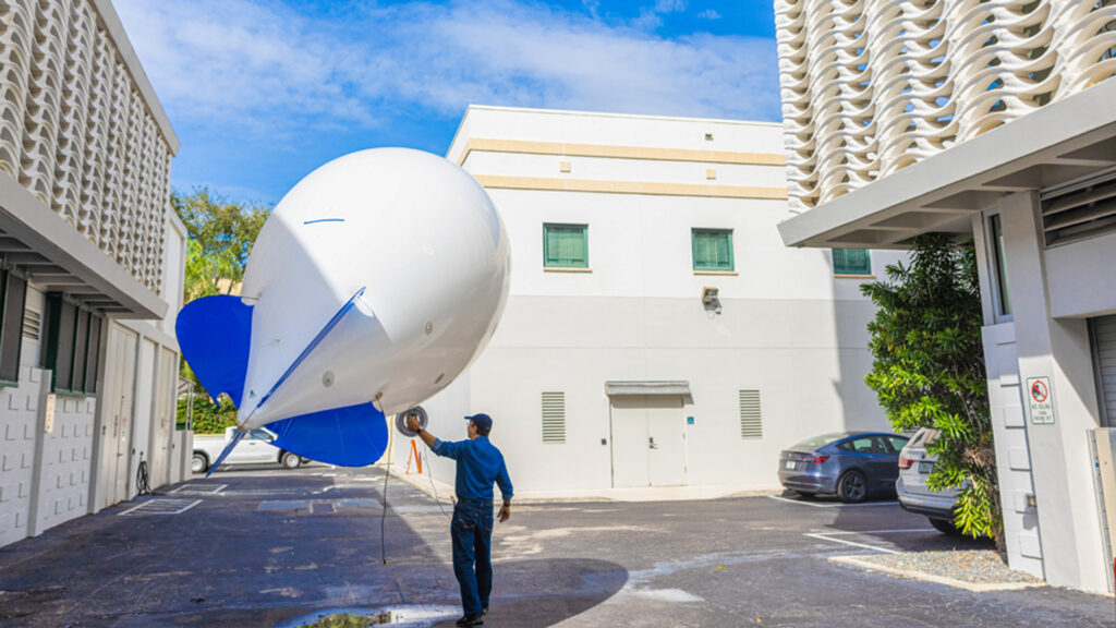 A 12-by-5-foot smart balloon will collect aerosol data at 200 feet of elevation over the McArthur Engineering Building. (Photo: Joshua Prezant/University of Miami)