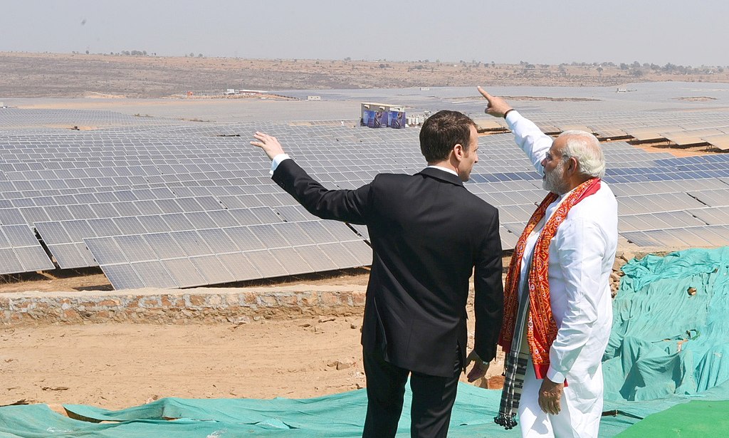 Indian Prime Minister Narendra Modi and French President Emmanuel Macron at the inauguration of the Solar Power Plant, at Mirzapur, Uttar Pradesh on March 12, 2018. India and China are poised to spearhead solar deployment in the Global South. (Ministry of Civil Aviation /GODL-India, via Wikimedia Commons)