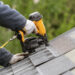 A worker installs a roof on a home (iStock image)
