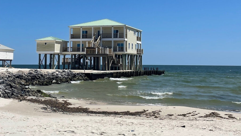 A house on Dauphin Island has been stranded out in the Gulf, as the beaches around it erode away. (Carrie Stevenson, UF/IFAS Extension)