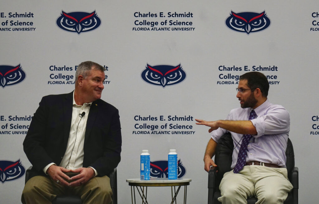 Charles “Buck” MacLaughlin (left) listens as Joshua Daskin speaks during an FAU panel discussion on the Florida Wildlife Corridor. (Photo by Naomi von Bose, FAU CES)