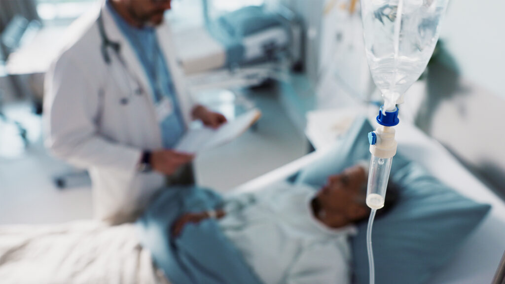 A doctor talks with a patient (iStock image)