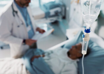 A doctor talks with a patient (iStock image)