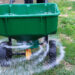 Seed and fertilizer are spread on a lawn. (iStock image)