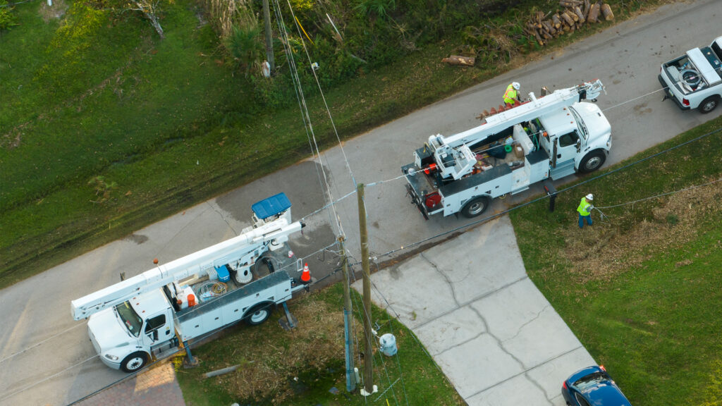 An aerial view of utility workers repairing power lines after Hurricane Ian (iStock image)