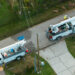 An aerial view of utility workers repairing power lines after Hurricane Ian (iStock image)